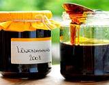 photo of two canning jars filled with dandelion honey