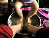 photo of father and baby enjoying a foot soak natural remedy for cold feet