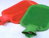 photo of a red and a green hot water bottle a good source to use for back pain relief