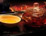 photo of a teapot and teacups filled with fresh brewed rose hip tea