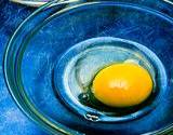 photo of raw eggs in a bowl a likely source of salmonella poisoning