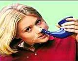 photo of a young woman using a neti-pot for hay fever relief