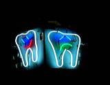 photo of neon teeth for dentist to advertise cavity prevention