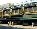 A building displaying sign The Vinegar Factory