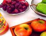 photo of apples, grapes and pears with vinegar showing benefits of vinegar of washing your fruit with vinegar