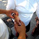 photo of a man performing acupressure on a woman's hand a natural source of hay fever relief