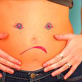 photo of a woman's belly with a sad face drawn on it, in need of peppermint tea recipe
