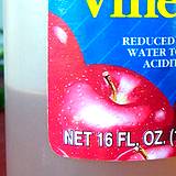 photo of a portion of an apple cider vinegar label on a bottle of vinegar