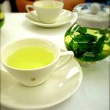 photo of a pot and a cup of green tea for natural fluoride for cavity prevention