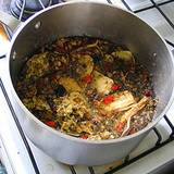 photo of a pot of a decoction of mixed herbs simmering on the stove