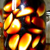 photo of herbal vinegar with jar of garlic soaking in vinegar