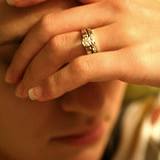 a woman holding her head in need of home remedy for headache