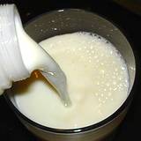 milk being poured into glass