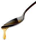 photo of honey dripping from a spoon