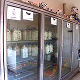 photo of milk case with old fashioned glass bottles of milk
