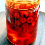 photo of a canning jar full of raspberry vinegar