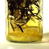 photo of a jar of herbal vinegar with rosemary and lemon