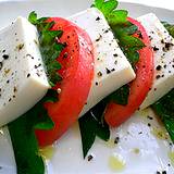 photo of a plate of tofu and tomatoes a natural source as menopause remedy