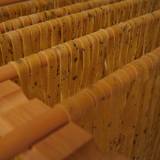 homemade pasta made from wheat hanging on a pasta rack to dry