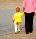 photo of a toddler walking along with bottom out